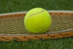 Tennis ball on racket