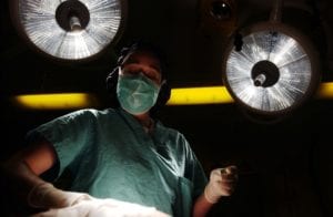 A surgeon operating