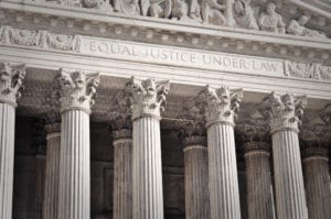 Courthouse pillars with words Equal Justice Under Law