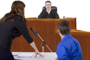 Woman addressing judge in courtroom
