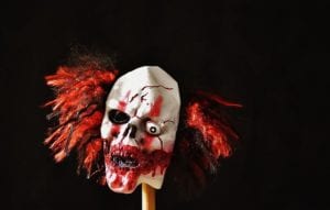 Bloody clown mask on a stick