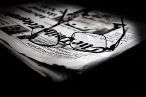 Eye glasses on newspaper