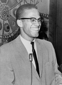 Black and white photo of Malcolm X