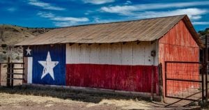 Barn with state flag of Texas painted on the side