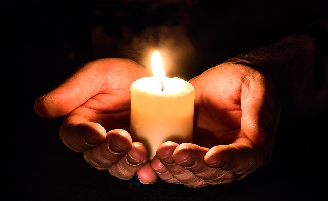 Person holding candle